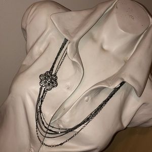 Multi chain floral pendant necklace.